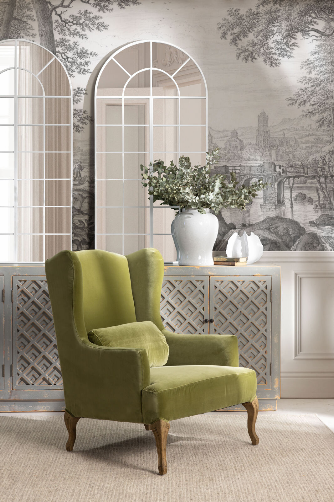 Green velvet wingback chair with oak legs Château collection