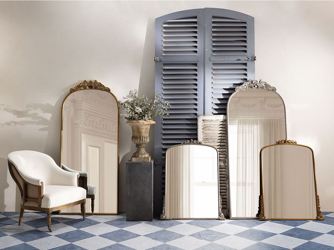 silver framed mirror with ornate top