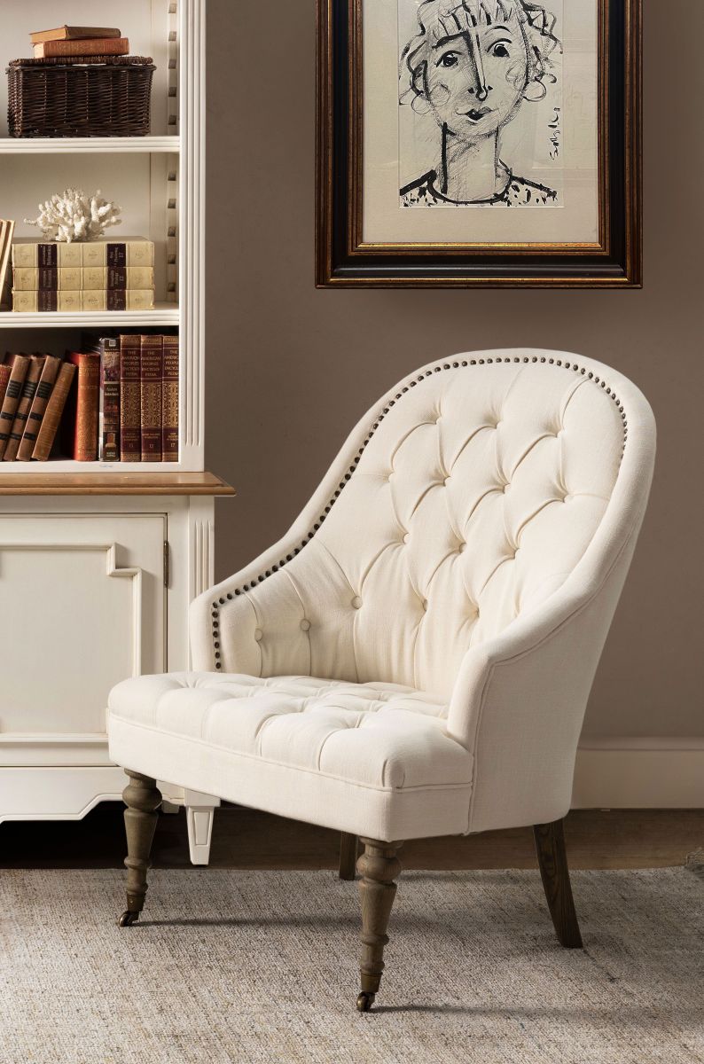 cream upholstered deco chair with deep buttoned detail, oak legs and castors, Château Collection 