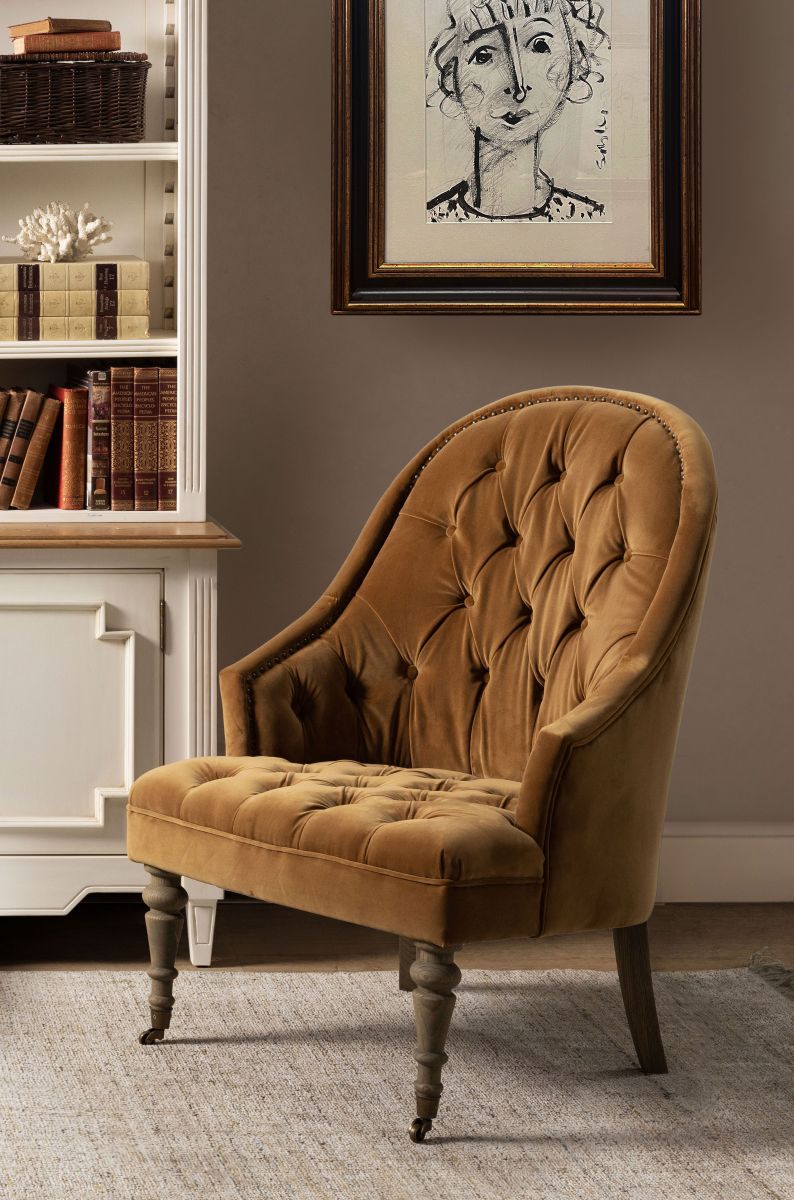 Deco chair upholstered in gold velour with deep buttoned detail, oak legs and castors Château Collection