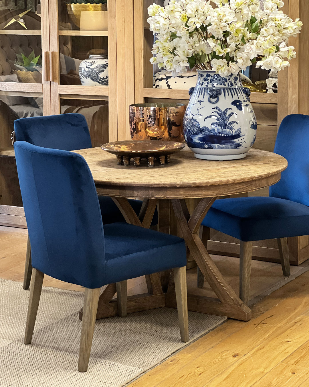 Block and chisel dining chair upholstered in royal blue