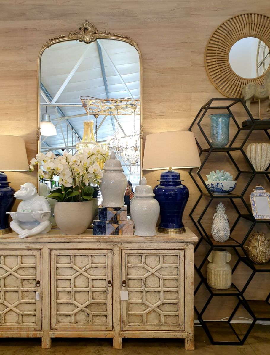 White chinese sideboard with detailed doors.