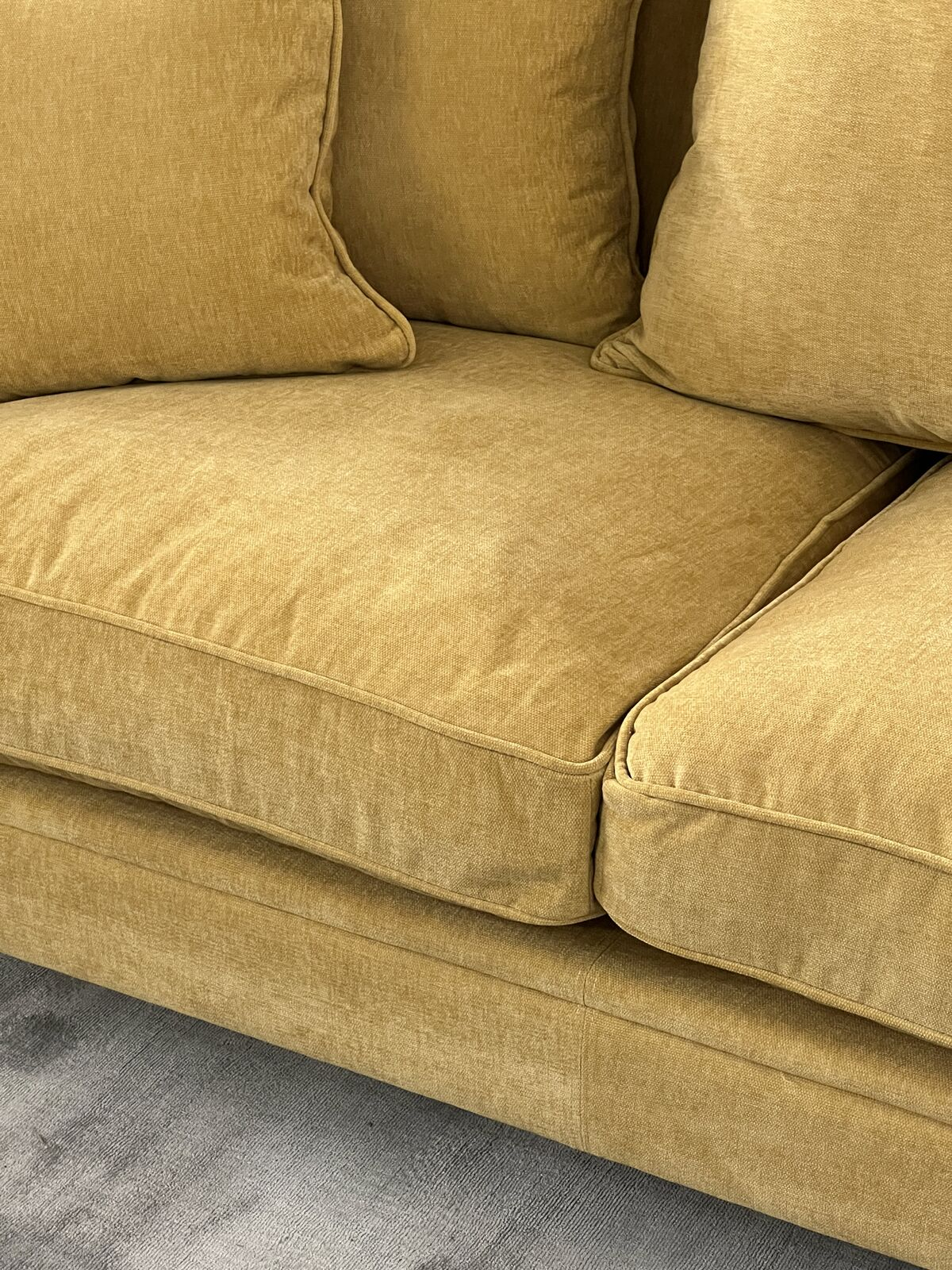 3 seater sofa upholstered in mustard velvet