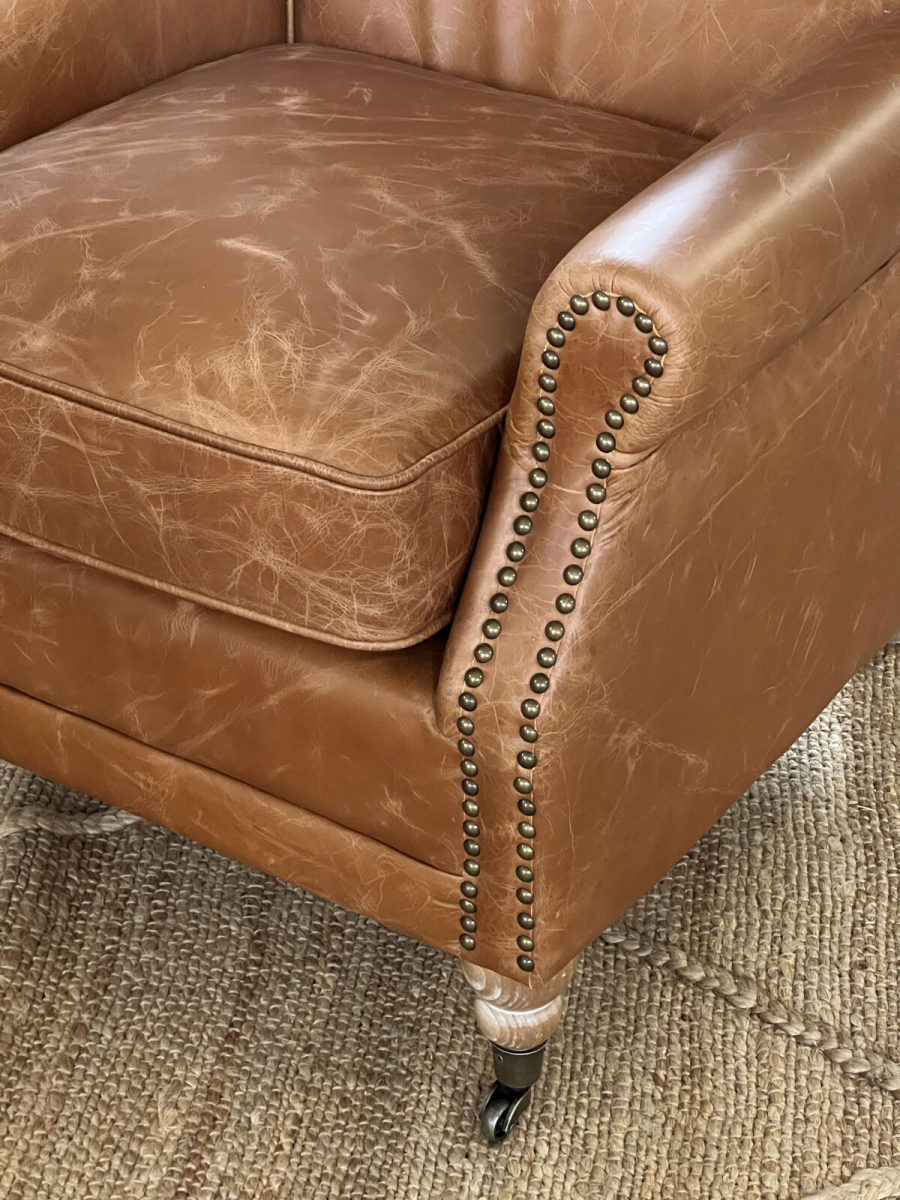 leather armchair on castors