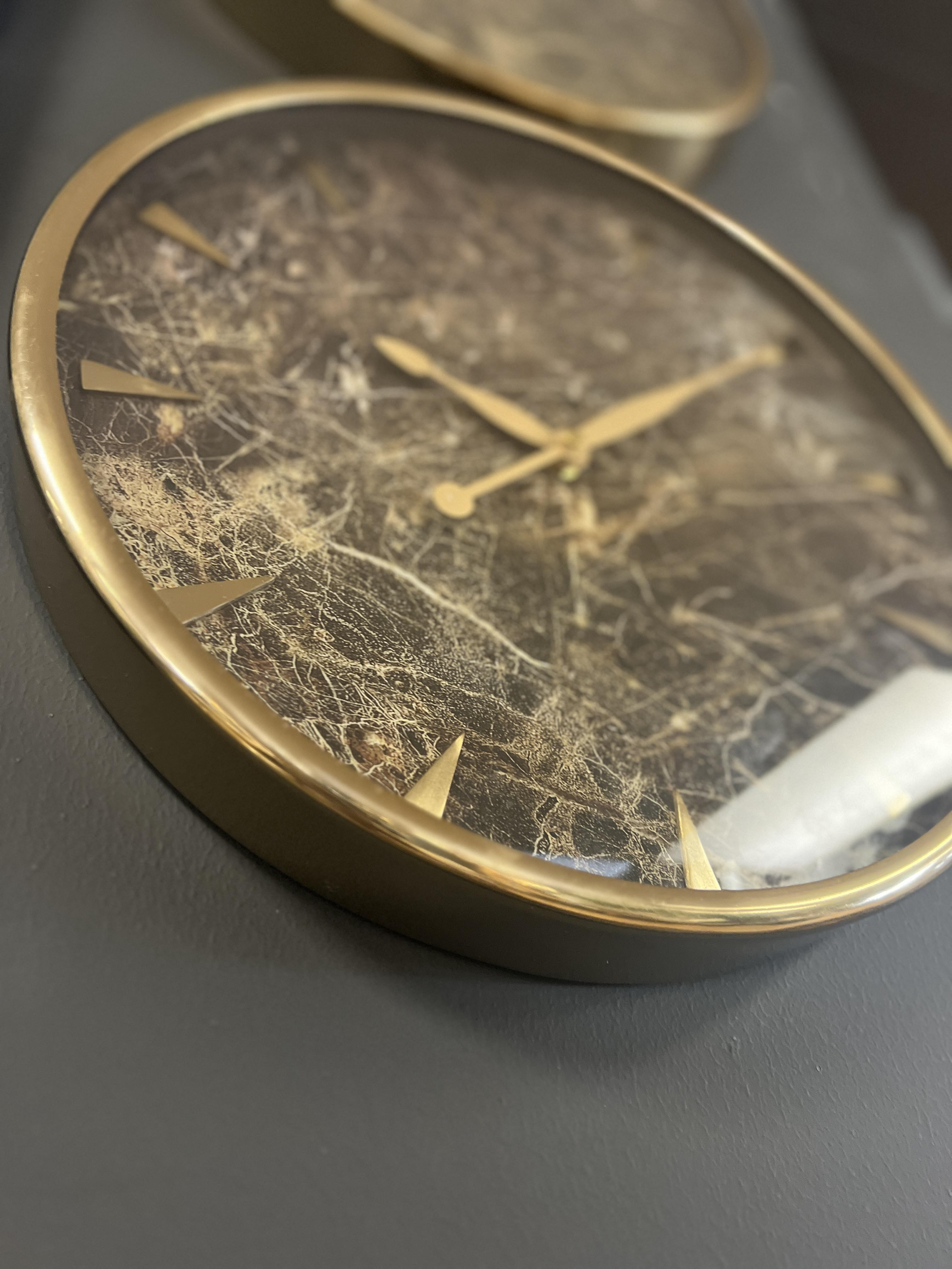 brushed metal wall clock with marble face 