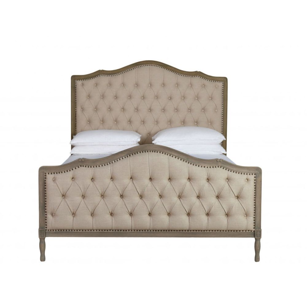 French style bed with deep button detail upholstered in linen