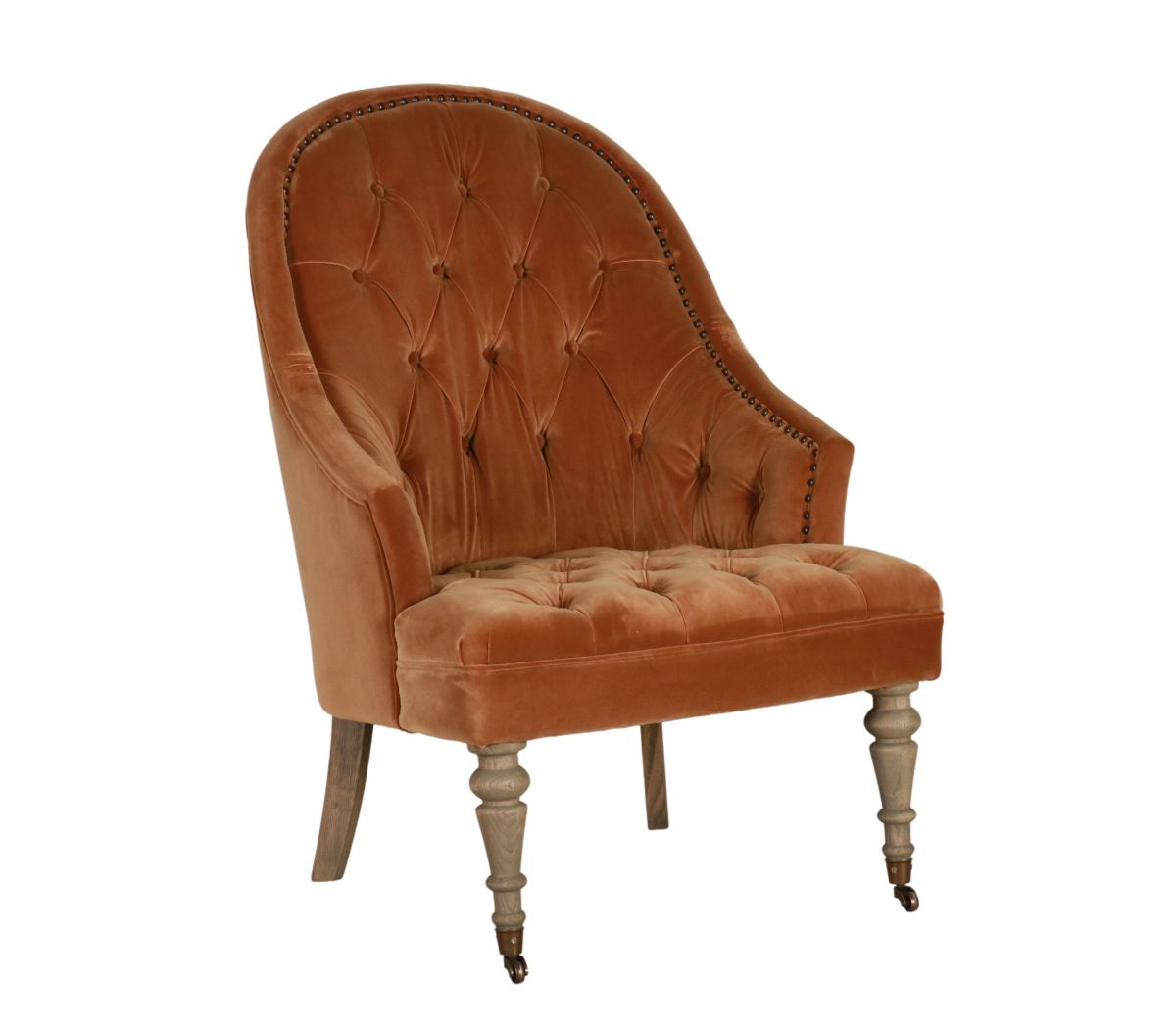 Deco chair upholstered in gold velour with deep buttoned detail, oak legs and castors Château Collection