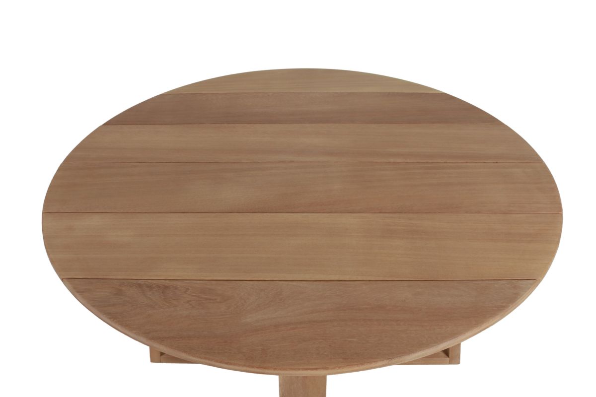 Round outdoor dining table in iroko