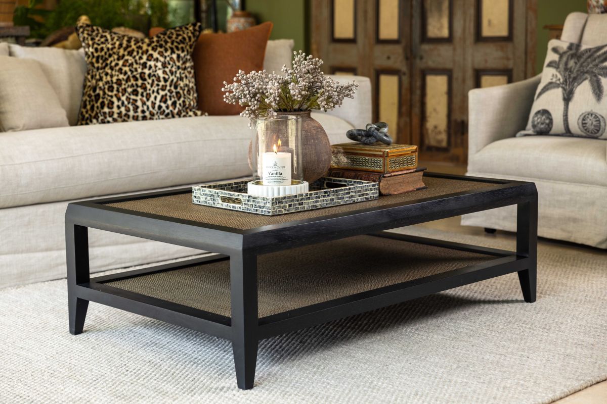 black frame coffee table with rattan inlay and bottom shelf 