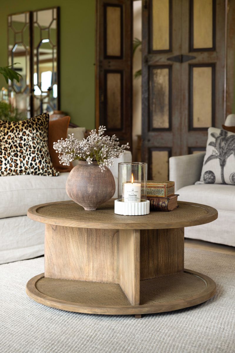 round wooden coffee table with rattan inlay