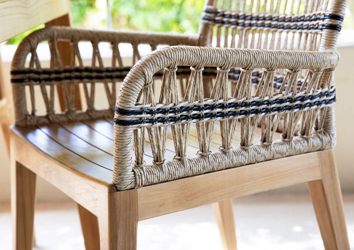 Outdoor dining armchair with teak frame and synthetic rope weave